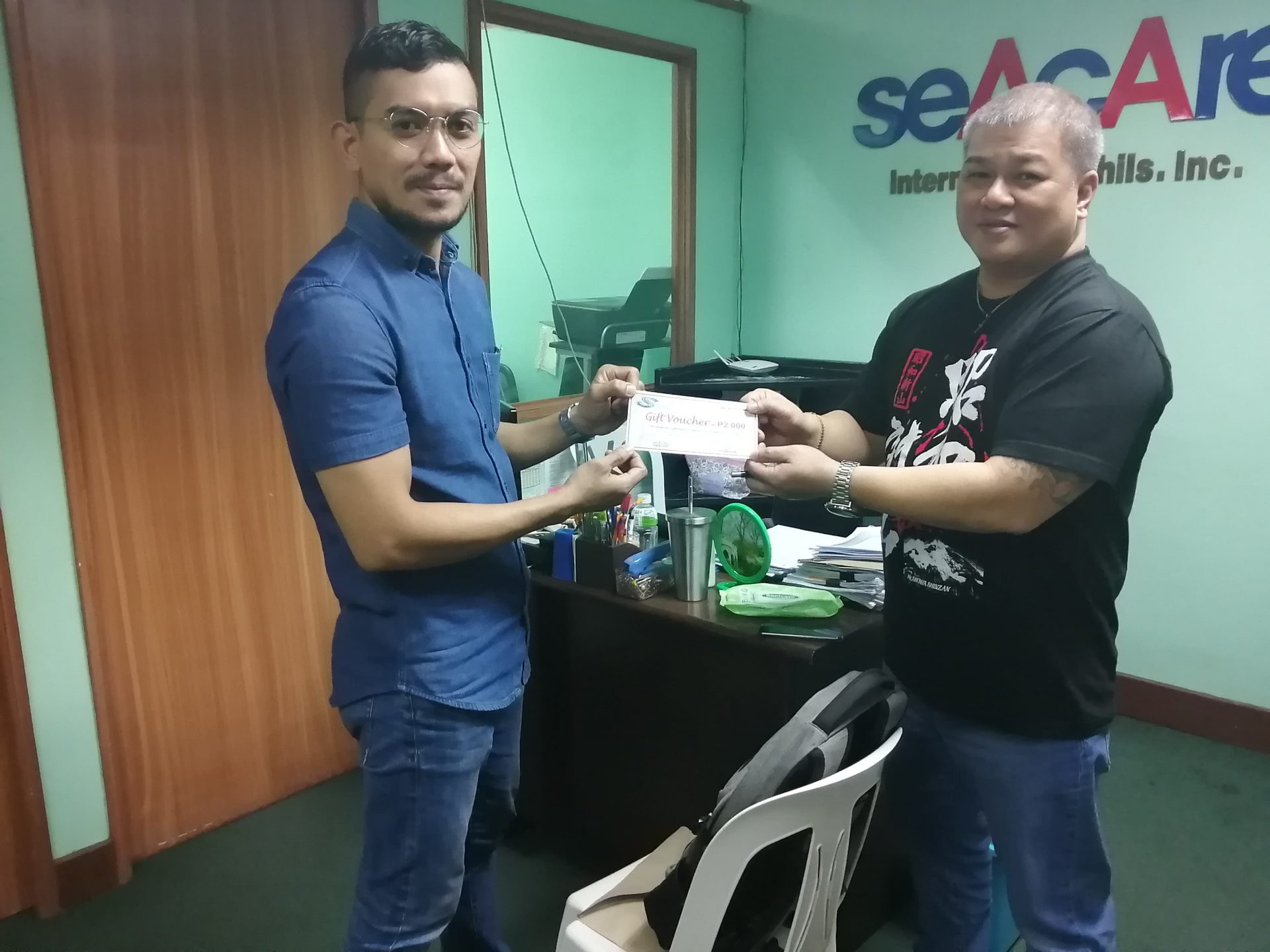 Presenting Slop Chest Gift Vouchers to SOS Filipino Members